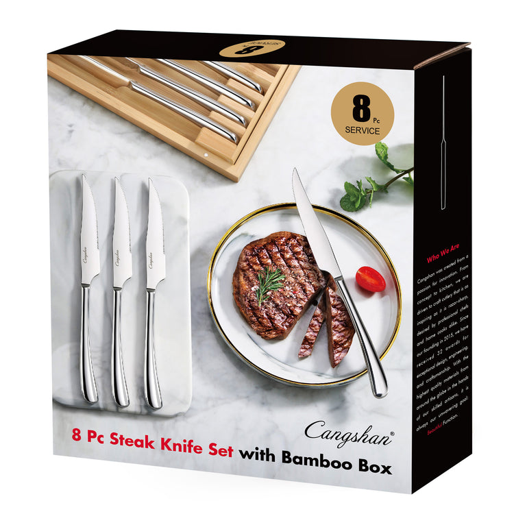 Eight-piece steak knife set with stainless steel blades and handles, displayed with a bamboo storage box and a steak on a pla