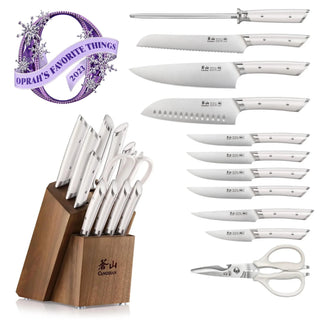 
                    
                      12-piece knife set with white handles, including various knives, sharpening steel, scissors, and acacia wood block.
                    
                  