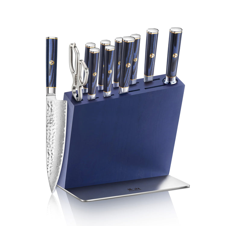Blue knife block set holding eight knives and kitchen shears, with one knife displayed outside the block.
