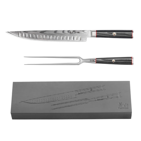Carving knife and fork with black handles and Damascus steel blades, displayed above a matching ash wood storage box.