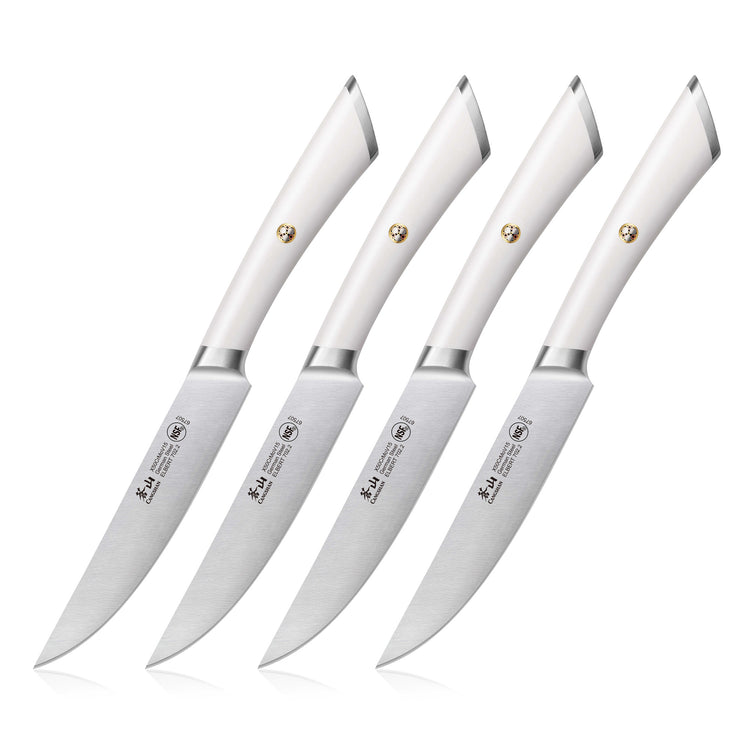Four steak knives with white handles and stainless steel blades arranged in a row.