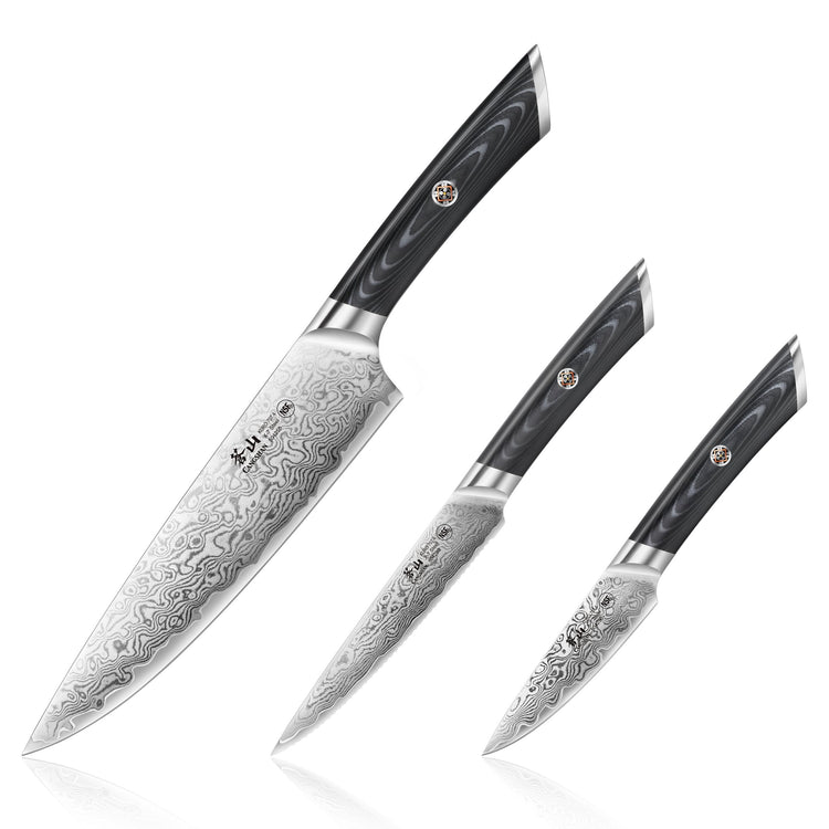 Three knives with patterned Damascus steel blades and black handles with a circular emblem, arranged diagonally.