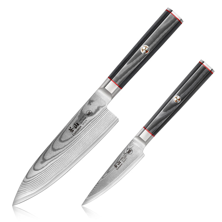 Two Damascus steel kitchen knives with black handles and red accents, one larger chef knife and one smaller paring knife.