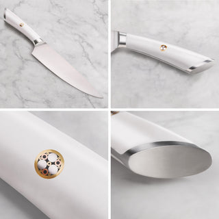 
                    
                      Chef knife with a white handle featuring a circular emblem and a polished stainless steel blade.
                    
                  