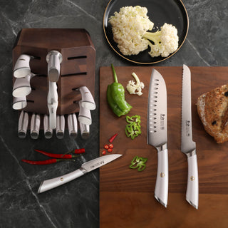 
                    
                      Knife block set with white-handled knives arranged on a dark wooden block and cutting board, alongside chopped vegetables and
                    
                  