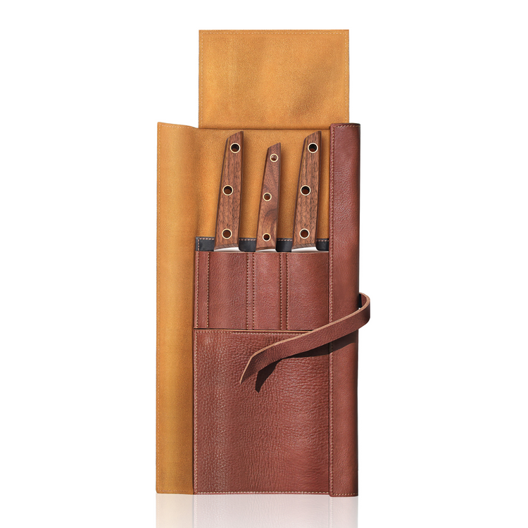Three knives with wooden handles in a brown leather roll-up case with a tie closure.