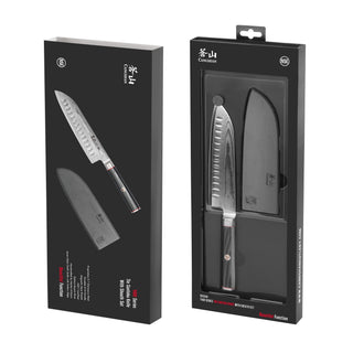 
                    
                      7-inch Santoku knife with black handle and protective sheath displayed in black retail packaging.
                    
                  