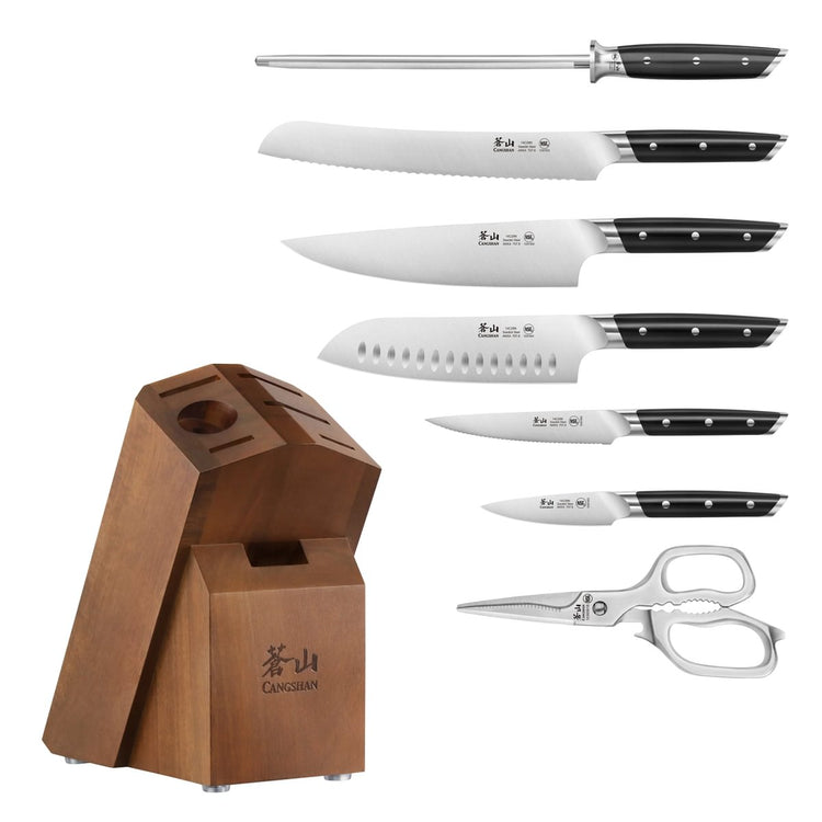 Eight-piece knife set with sharpening steel, kitchen shears, and wooden block with angled slots.