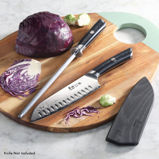 
                    
                      7-inch Santoku knife with black handle and sharpening steel on wooden board with sliced red cabbage and Brussels sprouts
                    
                  