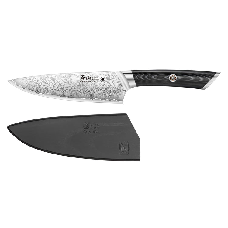 6-inch chef's knife with patterned Damascus steel blade and black handle, shown with a black protective sheath.