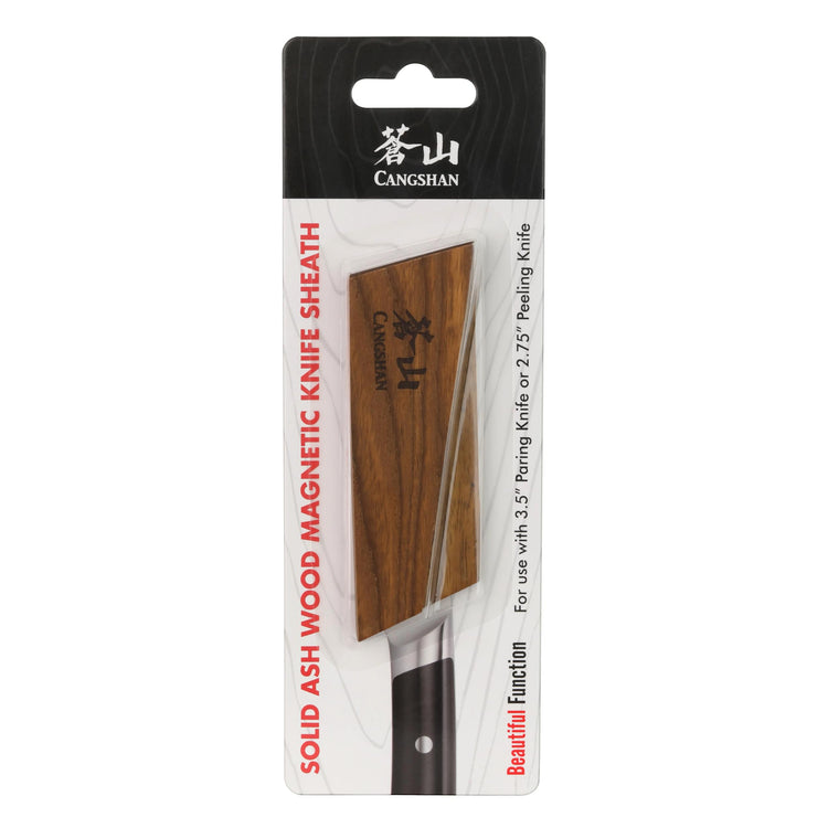 Solid ash wood magnetic knife sheath attached to a paring knife with a black handle in packaging.