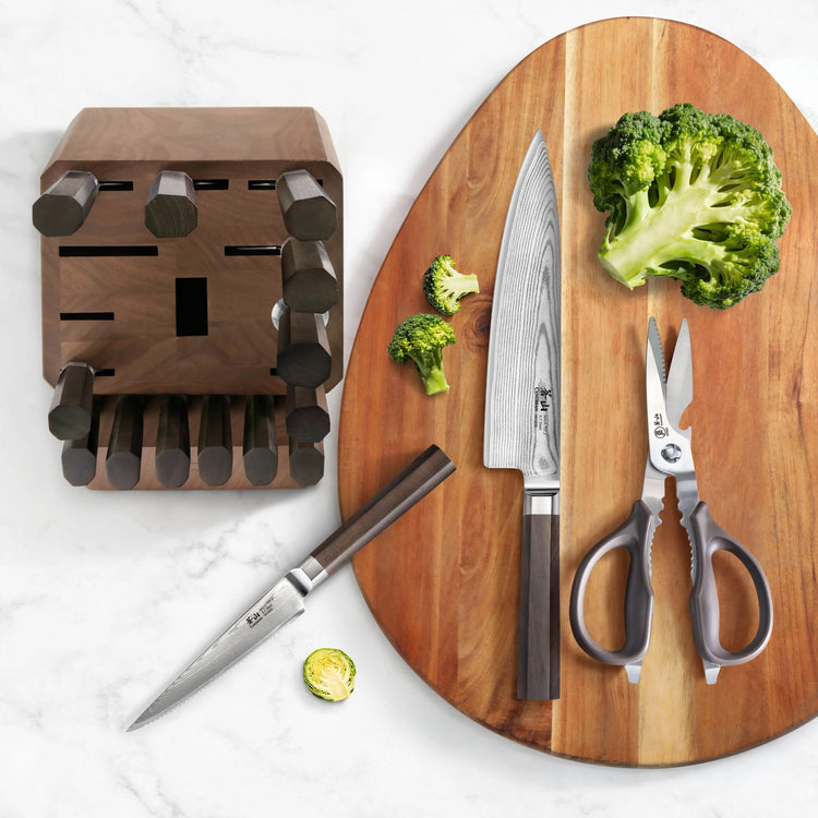 MAYA Series 17-Piece Knife Block Set featuring X-7 Damascus Steel blades, walnut block, shears, and cutting board.