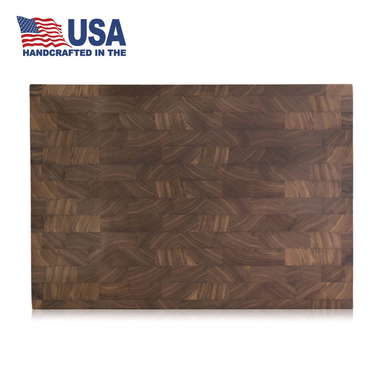 Rectangular end-grain walnut cutting board with a checkered wood pattern, handcrafted in the USA.