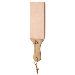 
                    
                      Rectangular paddle strop with light leather surface and wooden handle featuring a hanging loop.
                    
                  