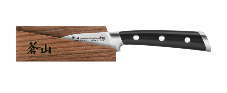 2.75-inch peeling knife with black handle and three rivets, resting on a wooden sheath with black Japanese characters.
