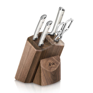 
                    
                      Set of three stainless steel knives and a pair of scissors in a wooden knife block with a small compartment.
                    
                  