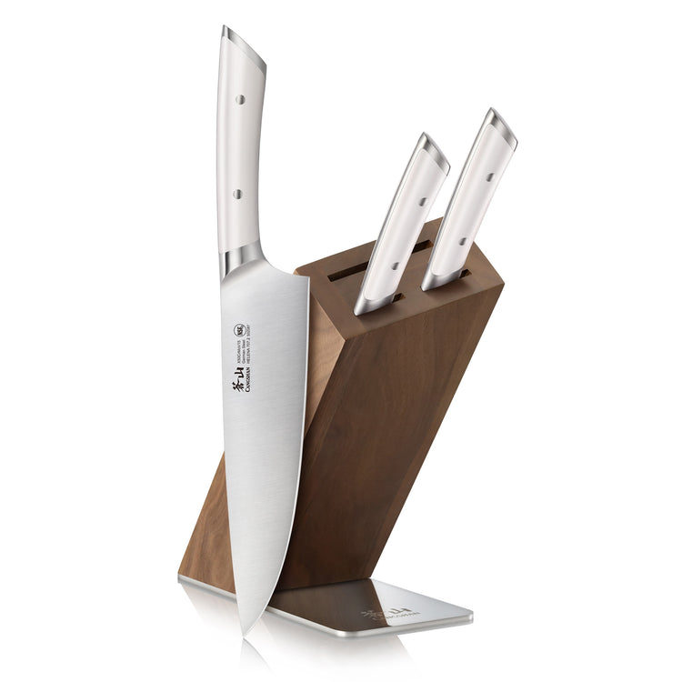 Four-piece knife set with three knives inserted in a wooden block angled on a metal base.