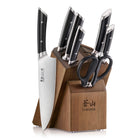 Knife block set with six knives and kitchen shears in a wooden acacia block with angled slots.
