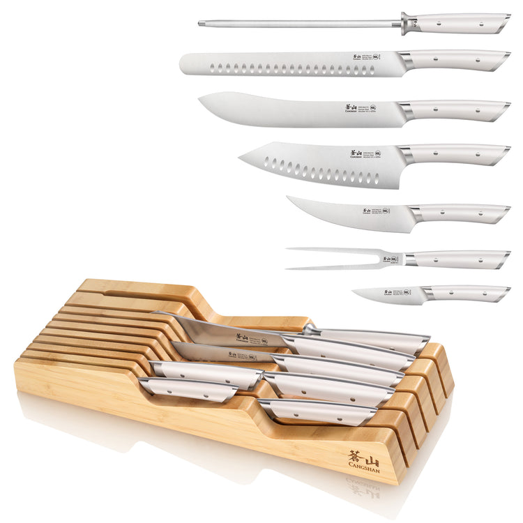 Eight-piece knife set with white handles and a bamboo in-drawer organizer, including various BBQ knives and a sharpening stee