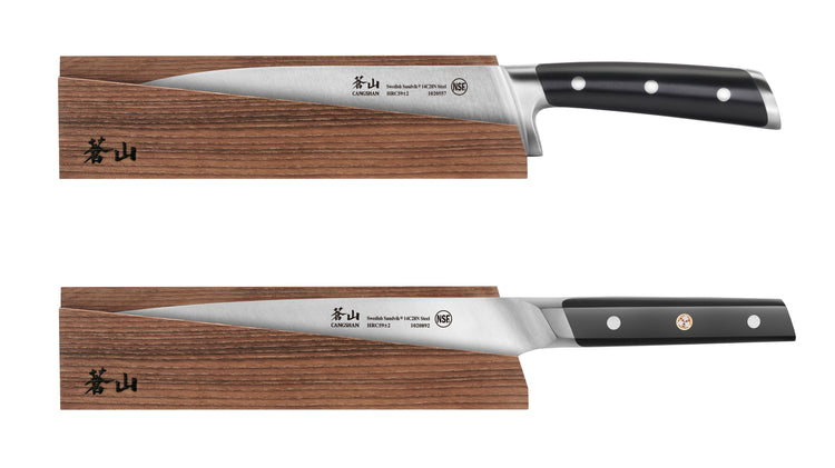 Two kitchen knives with black handles resting on solid ash wood magnetic sheaths, one with a curved blade and one with a stra