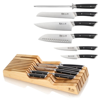 
                    
                      Seven-piece knife set with black handles and a bamboo in-drawer storage tray, including sharpening steel and various knives.
                    
                  