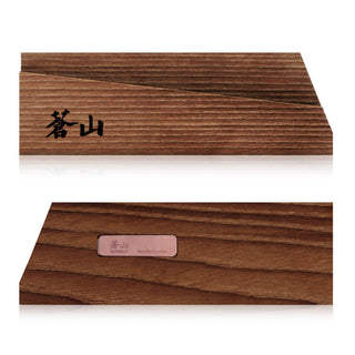 
                    
                      Solid ash wood magnetic knife sheath with Japanese characters on one side and a metal label on the back.
                    
                  
