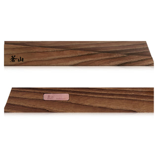 
                    
                      Solid ash wood magnetic knife sheath with angled edges and engraved Japanese characters on one side.
                    
                  