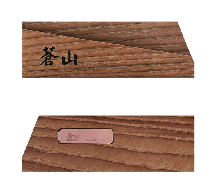 Solid ash wood magnetic knife sheath with angled design and engraved Asian characters on the surface.