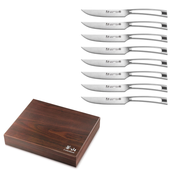 Eight straight edge steak knives with stainless steel handles arranged next to a closed walnut wood storage box.