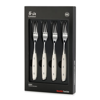 
                    
                      Four stainless steel steak forks with white handles arranged in black packaging box.
                    
                  