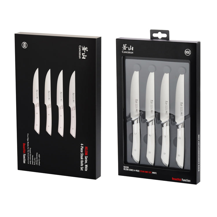 Four white-handled steak knives displayed in black retail packaging with clear front panel.