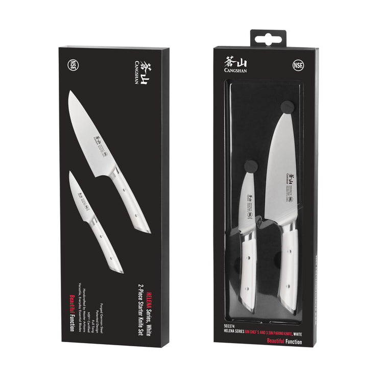Two white-handled kitchen knives, a chef's knife and a paring knife, displayed in black packaging with product branding.