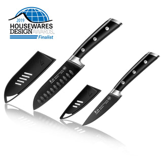 
                    
                      Two black kitchen knives with black protective sheaths and three-rivet handles, labeled as 2019 Housewares Design Awards finalist.
                    
                  